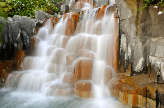 Small waterfall. The water is in motion blur.