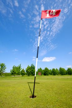 Golf flag. Taken on a warm summer day.