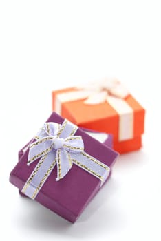 Two gift boxes diagonally isolated on white