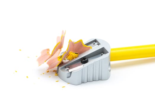 Pencil sharpener with yellow pencil and shavings
