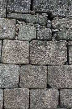 Close view of an old castle textured stone wall. 
