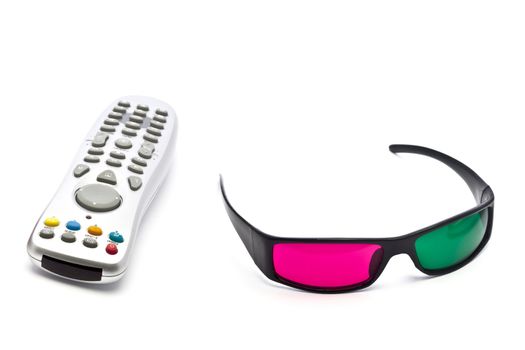 A pair of anaglyph 3D glasses and remote control on a white background.