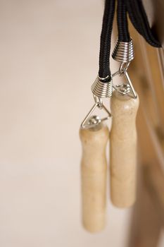 Close-up of two wooden jump rope handles.