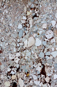 Close up view of a mixed marble textured wall.