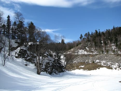 Rocks; a relief; a landscape; a hill; a panorama; mountains