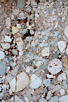 Close up view of a mixed marble textured wall.