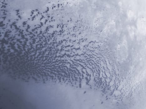 Strange patterns formed on an icy river.