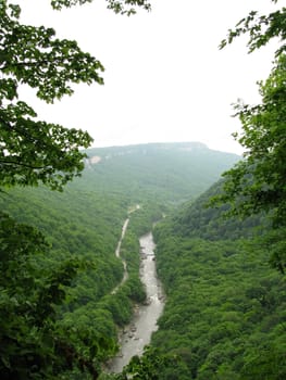 Greens; the Caucasian ridge; rocks; a relief; a landscape; a hill; a panorama; mountains; Caucasus; mountain; a slope