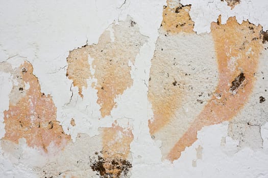 Close up view of a worn textured cement wall.