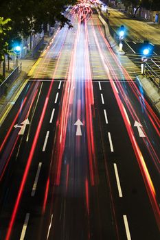 traffic in city at night with long car light