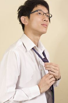 Young Asian man wearing suit
