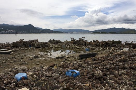 Garbage piled up on the coast of the ocean