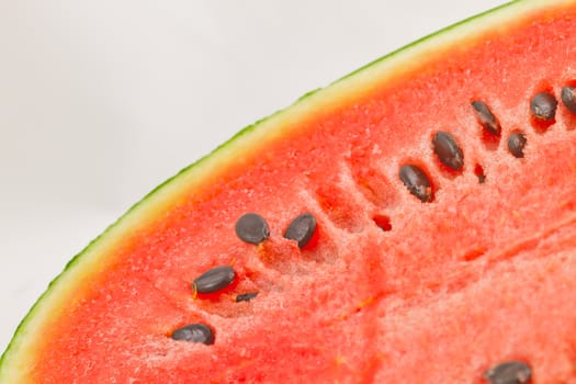 Half cut watermelon on white background.