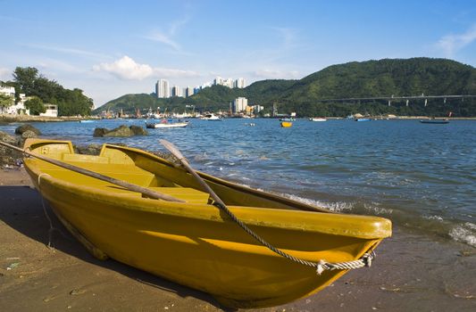 yellow boat on the beach and sky