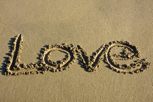love message written in sand and texture area
