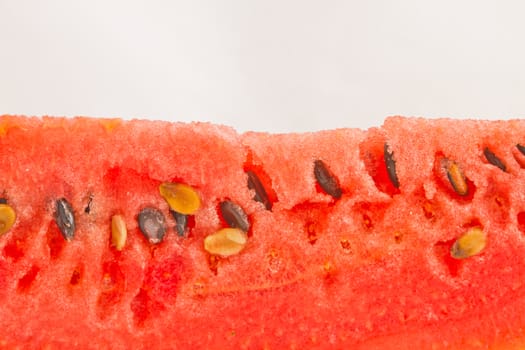 Close up of watermelon and seeds, isolated on white