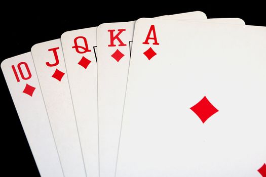 Royal Flush of diamonds, pokerhand on black background