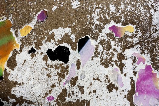 Close up view of a worn textured cement wall.