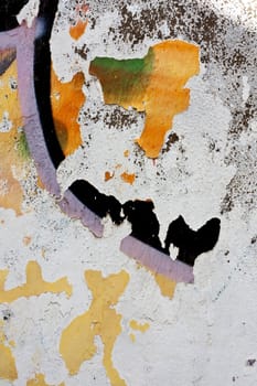 Close up view of a worn textured cement wall.