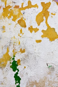 Close up view of a worn textured cement wall.