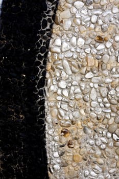 Close up view of a worn textured cement wall.