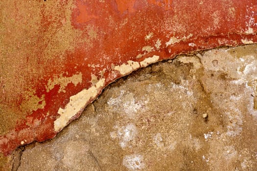 Close up view of a worn textured cement wall.