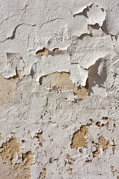 Close up view of a worn textured cement wall.