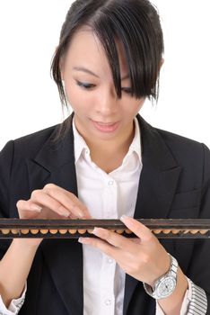 Chinese business woman with excitation using abacus against white background.