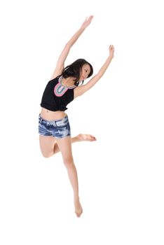 Stylish young beauty dancing and jumping on white background.