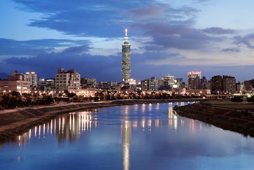 Serenity cityscape with skyscraper and river in night in Taipei, Taiwan.