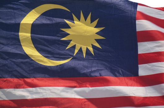 Malaysian flag waving with a strong wind