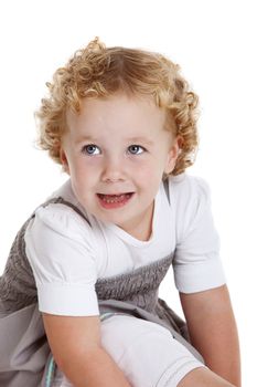 Cute three year old girl on white background looking happy