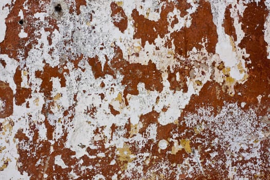 Close up view of a worn textured cement wall.