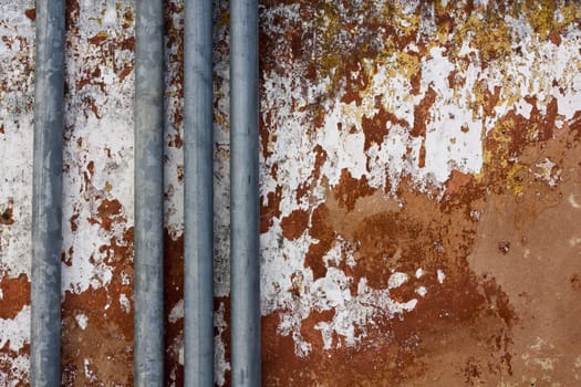 Close up view of a worn textured cement wall.