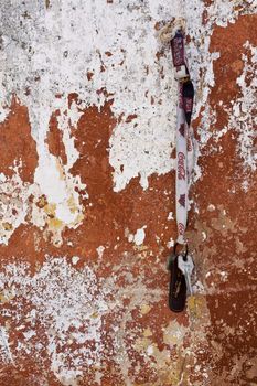 Close up view of a worn textured cement wall.