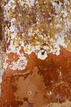 Close up view of a worn textured cement wall.