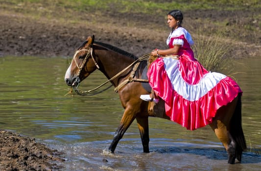 TACUAREMBO, URUGUAY - MAR 6 : Participant in the annual festival "Patria Gaucha" March 6, 2010 in Tacuarembo, Uruguay. It is one of the biggest festival in South America to celebrate gaucho culture