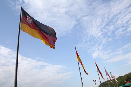 Rhineland-Palatinate flag waving among others state flags on the German Corner in Koblenz, Germany.