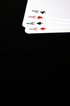winning concept with four aces on black background