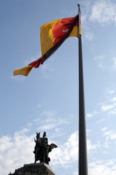 Emperor William I and the Rhineland-Palatinate flag at the German Corner in Koblenz.