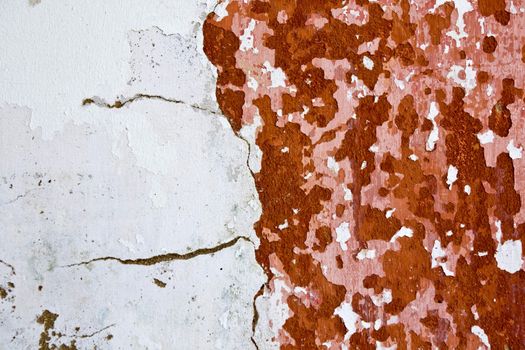 View of an old and peeled painted wall texture.