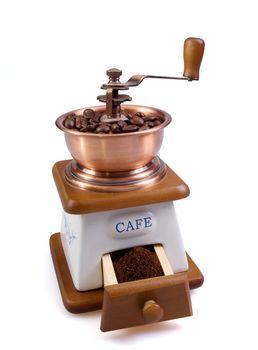 White coffee grinder with coffee grains