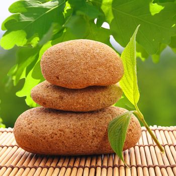 zen stack or tower with green summer leaf showing spa or wellness