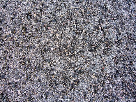 Close up view of asphalt from a road.