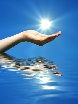 hand holding sun and water reflaction with copyspace