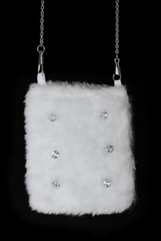 White fur pouch with pastes. Isolated on black background