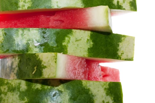 Stack of fresh pieces of watermelon isolated over white.