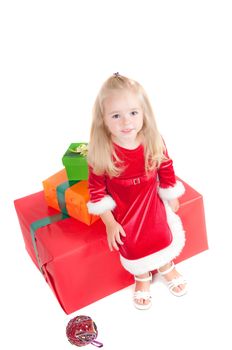 Christmas toddler with present boxes, studio shot