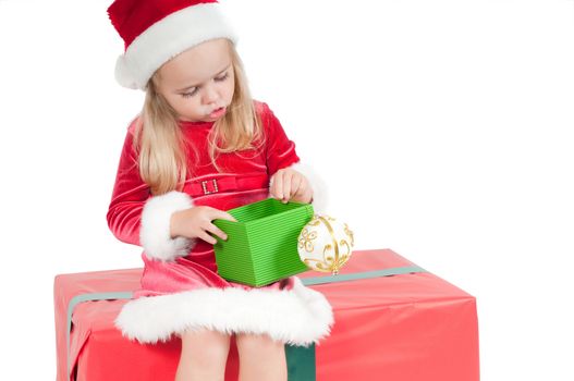 Christmas toddler with present boxes, studio shot