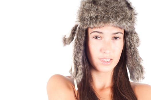 Studio shot of beautiful woman in fur hat